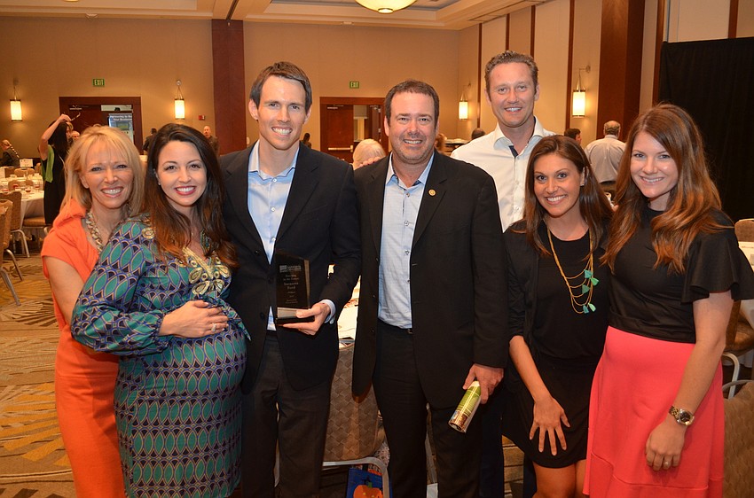 Matt Buchanan from Sarasota Ford with friends and family after winning the 