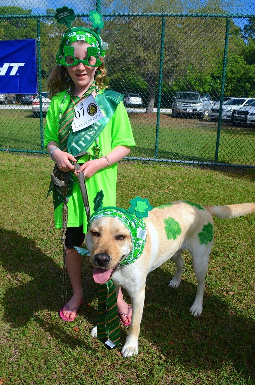Sarah Campbell and her decorated dog, Nick, show off their green.