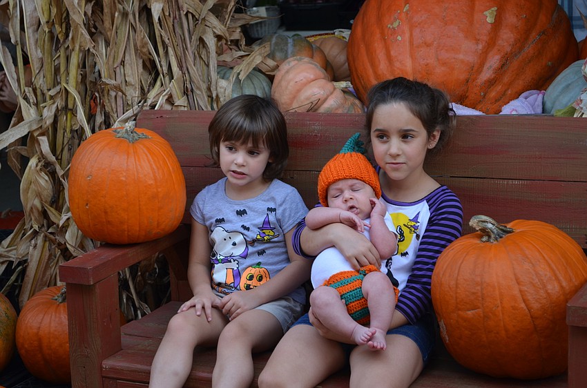 Amelia, Olivia and Owen Bankirk have their photo taken.