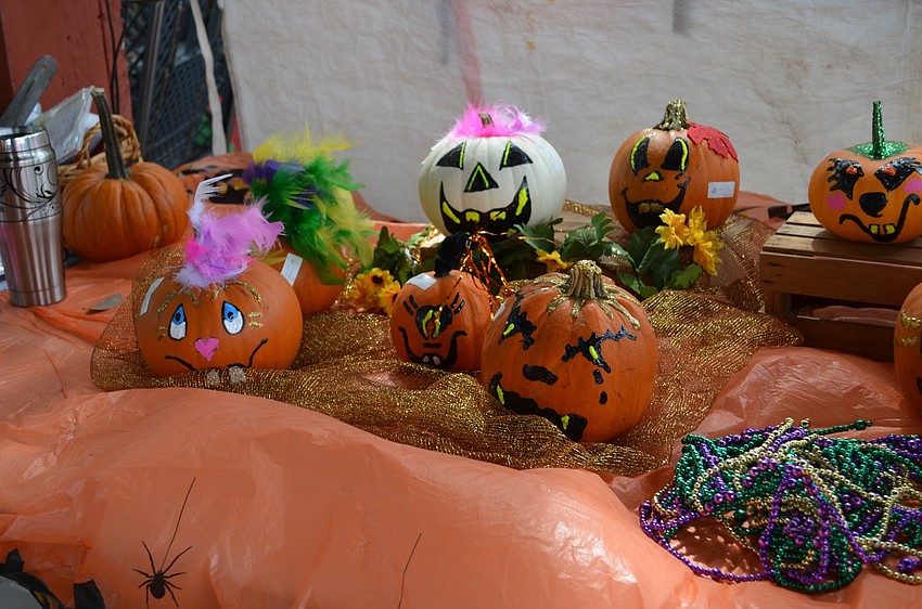 Children were allowed to paint and decorate pumpkins to take home.