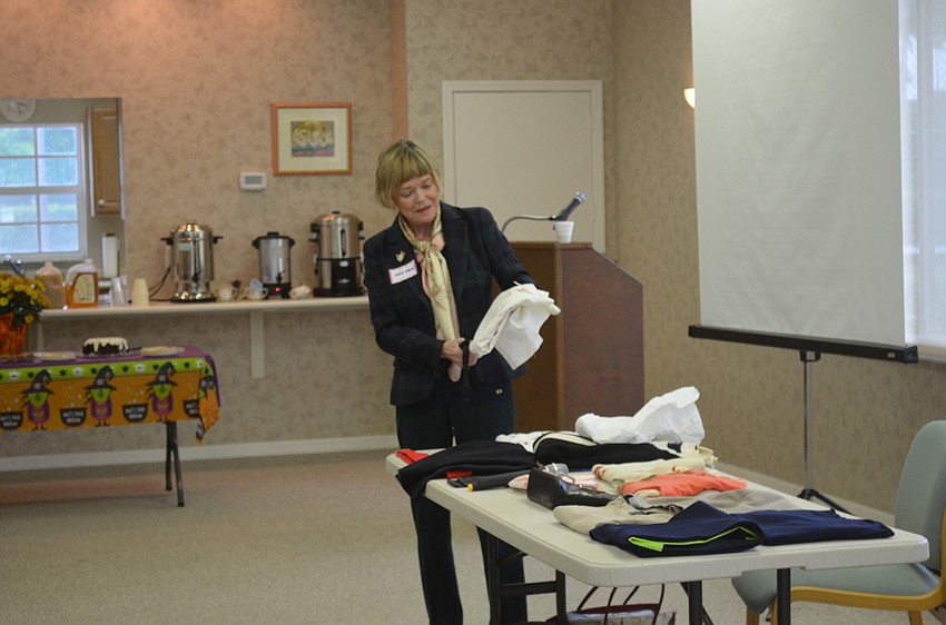 Janis Fawn shows the Garden Club what to bring on a two-week trip.