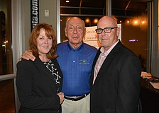 Allison and Gary Fennessy, owners of Main Street Trattoria who hosted Tuesday's pediatric cancer fundraiser, visit with Dick Vitale on Tuesday night.