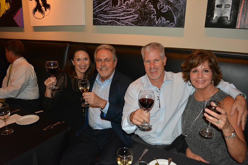 Mary Kenealy-Barbetta, Joe Barbetta, Tony DiMare and Debbie DiMare of Lakewood Ranch enjoy the wine before dinner is served at the Dick and Lorraine Vitale fundraiser.