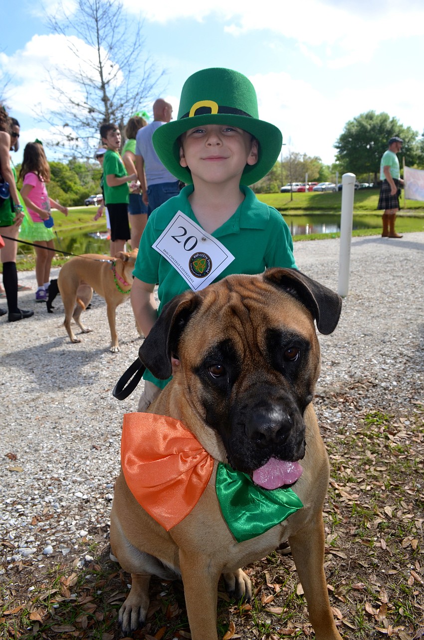 Laughlin Gillette and his furry friend, Alistair, find their place in the parade line.