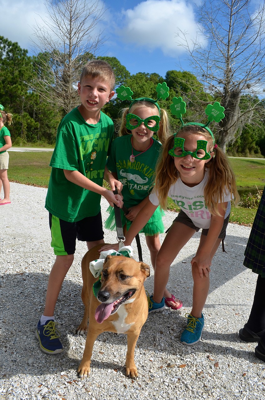 Joshua and Dakota Holler say cheese with their friends, Danielle Kirchberg and Penny.