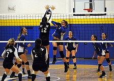 Sarasota Christian's Cheyenne Miller sends the ball back over the net for a point in the first set.