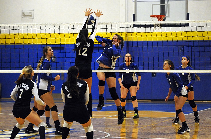 Sarasota Christian's Cheyenne Miller sends the ball back over the net for a point in the first set.
