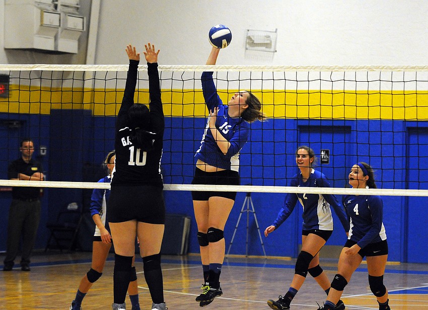 Sarasota Christian's Annika Jensen hits the ball back over the net in the first set.