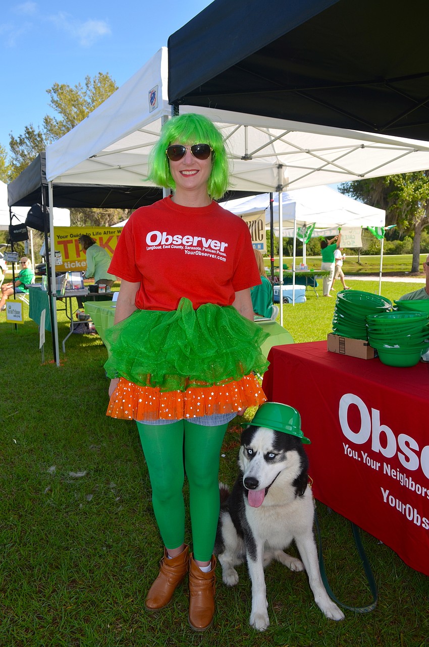 Richeal Parisi and her dog, Maverick, show their Observer pride.