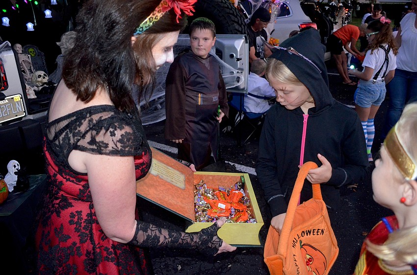 Judy Young serves up chocolate to Sara Martin.