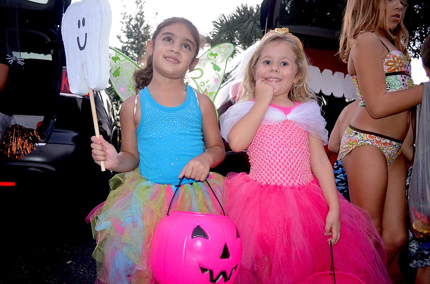 Haven Wood, the tooth fairy, and Braelyn Schroeder, a princess, pulled out their tutus and pink candy baskets.