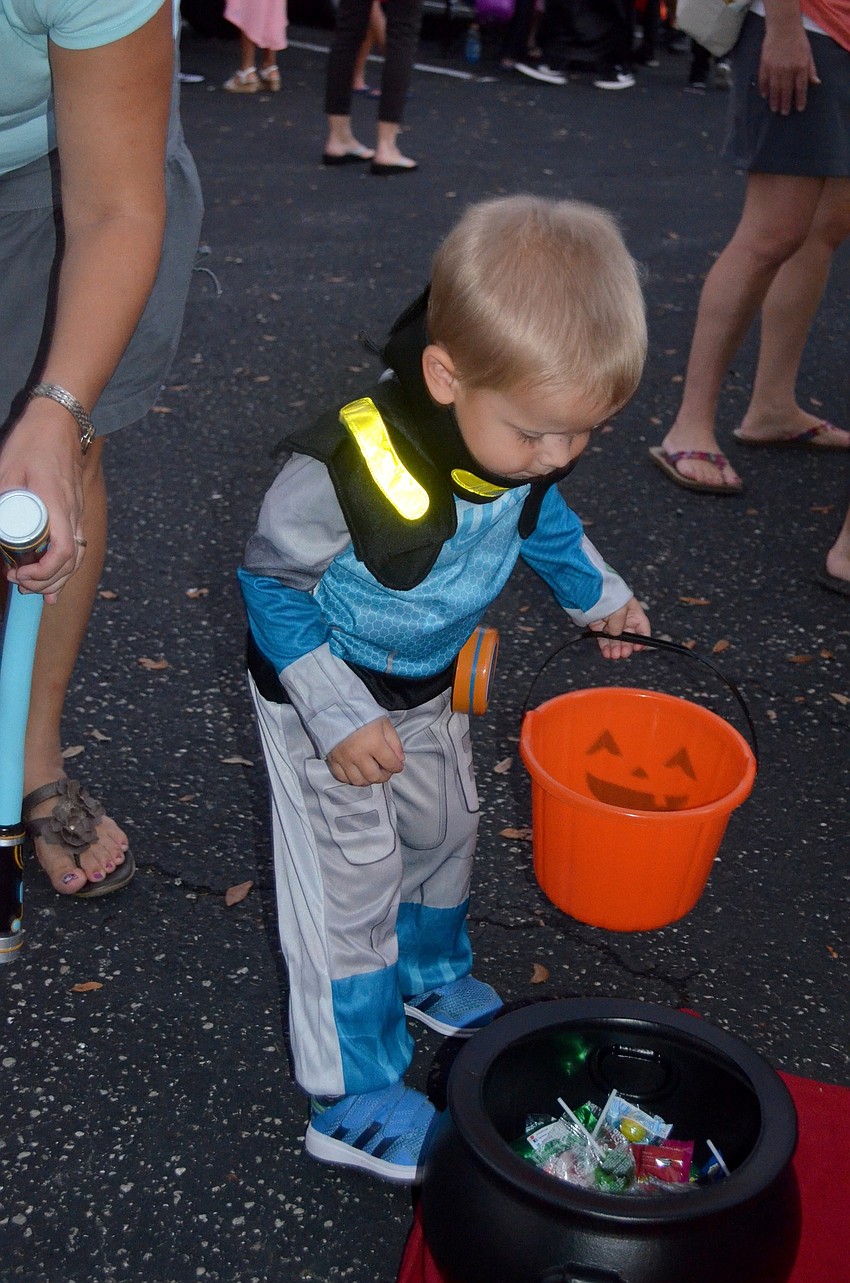 Christopher Chroust carefully selects candy.