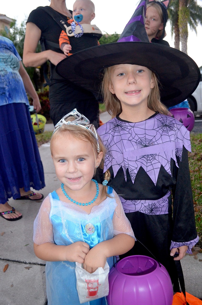 Alice Gustek and her sister, Joanna, dress up as a princess and a witch.