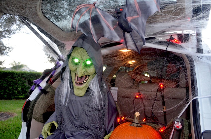 Witches, warlocks, lights and pumpkins lined the inside of car trunks.