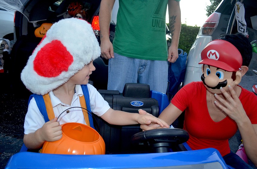 Deon Carter and his mother, Jay, dress as video game characters.