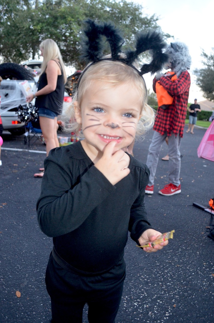 Whitney Berry, 2, meows for candy.