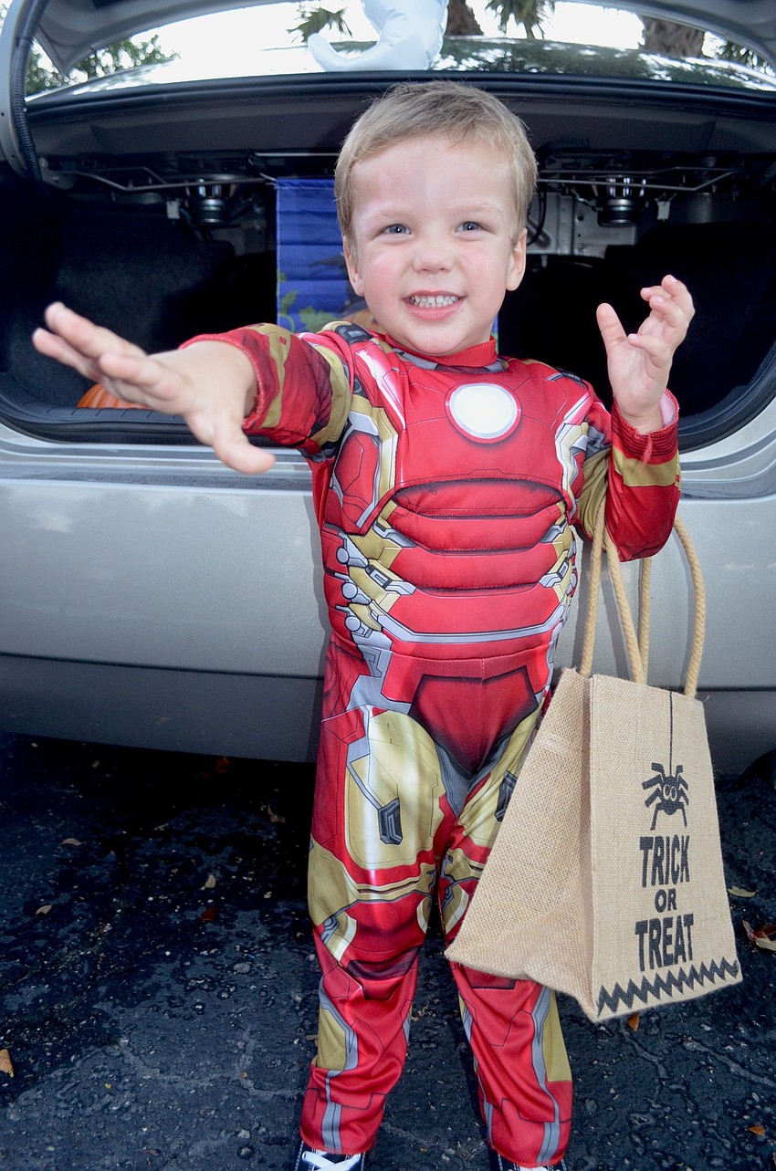 Two-year-old Max Benham shows off an Iron Man pose.
