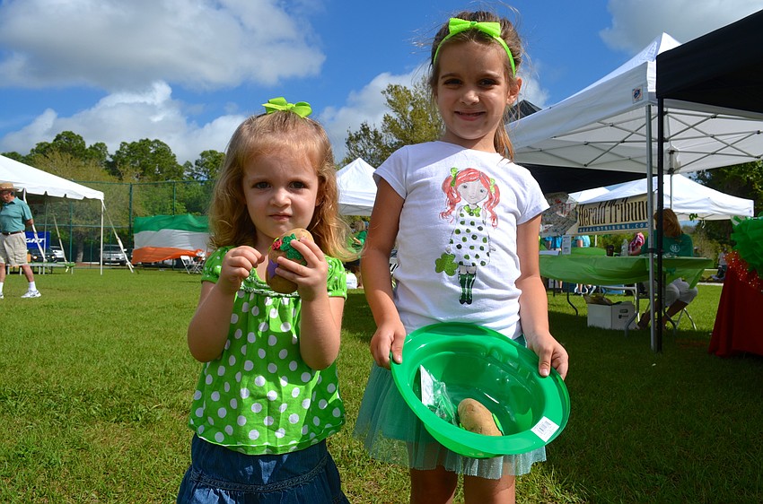 Sisters Ally and Paige Broderick show off their prizes from the festival.