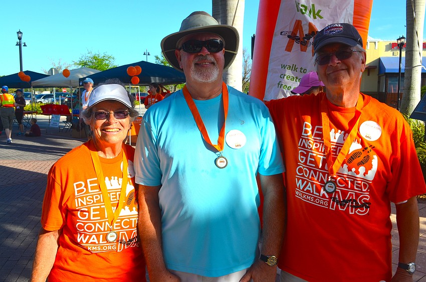Joe Geiss rests in the shade, flanked by Bernice and Tony Annunziata.