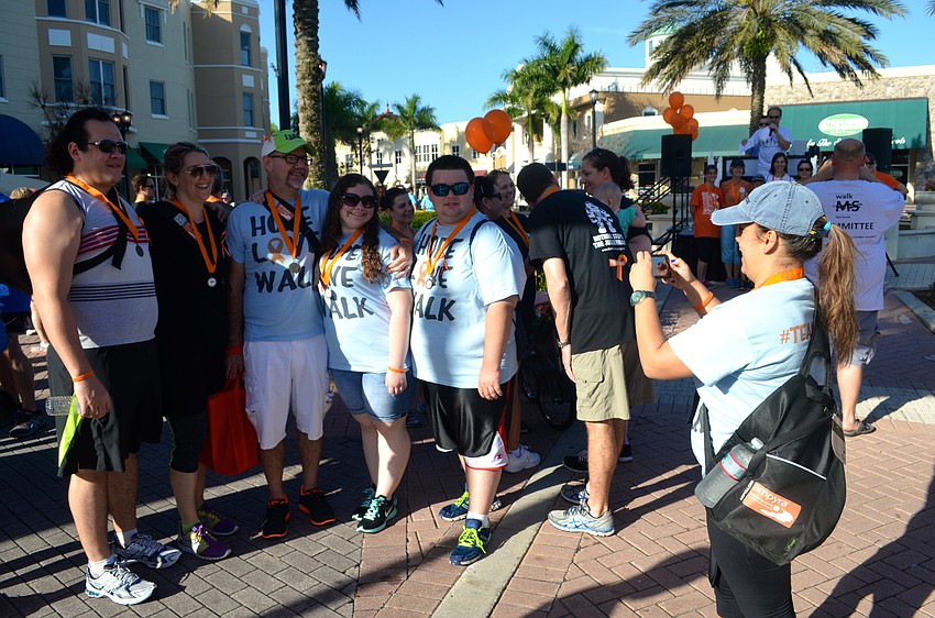 Antoinette French takes a photo of her team, #TeamElana, after they finish walking.