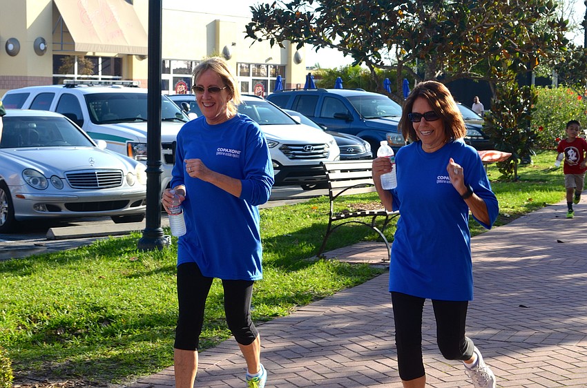 Susan McGrath and Donna Hibbard walk for their friend, Susie Wyss.