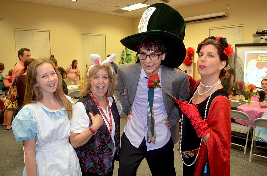 Event hosts Shannon Mallard, Chris Culp, Jacob Owens and Maureen Flaherty dress for the occasion and theme of the night.