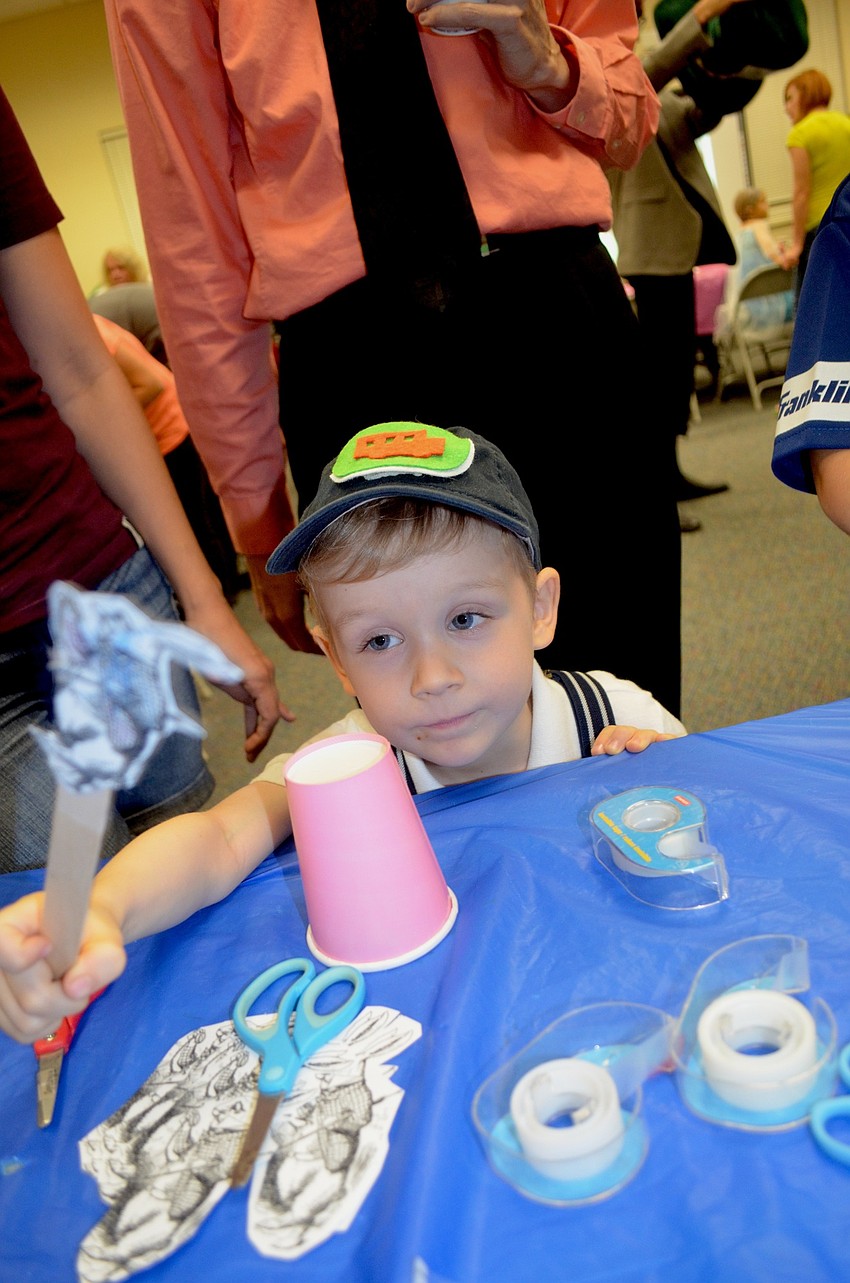 Caleb West, of Bradenton, makes his paper rabbit dance.