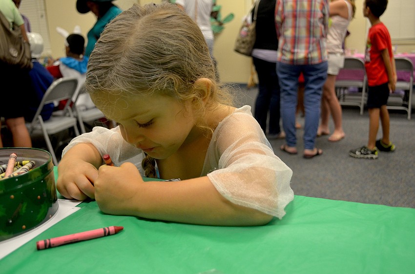 Ansley Kidd, of Bradenton, colors a picture of 