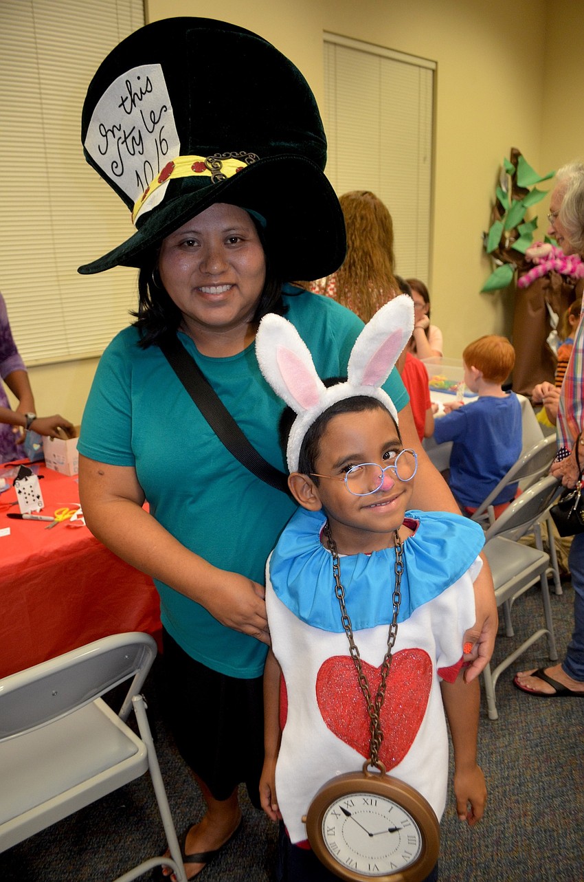 Bradenton residents Erica Martinez and her son, Eliberto, show off Mad Hater and the White Rabbit.