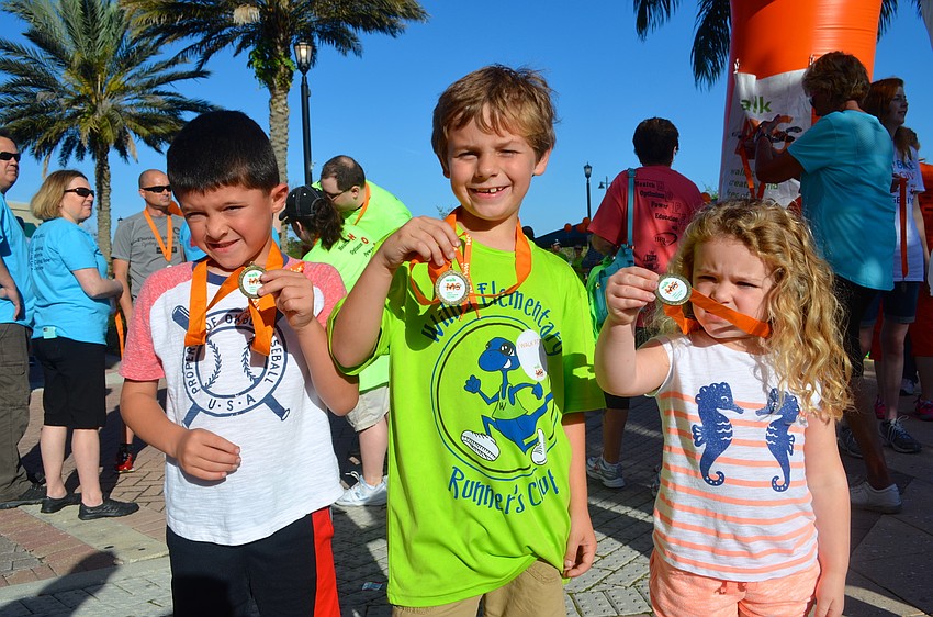 Dylan Neuweiler, Dylan Graziano and Brooklyn Neuweiler show off their medals.