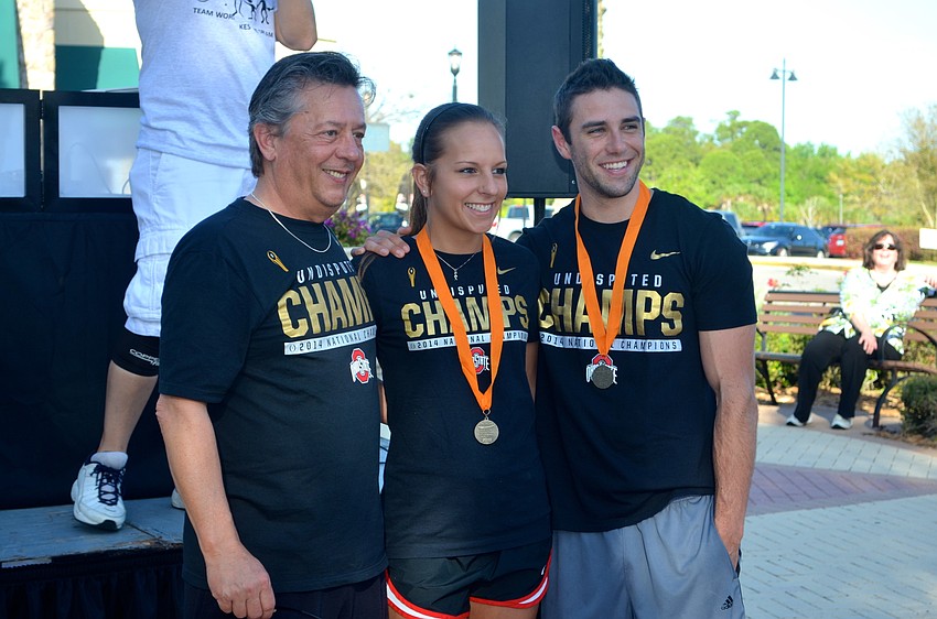 Don and Alexa Strejeck say cheese after the race, alongside Shawn O’Keefe.