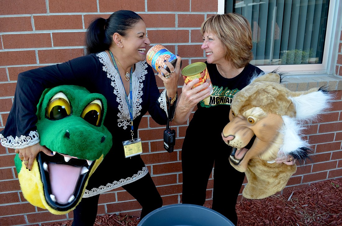 B.D. Gullett Elementary Principal Shirin Gibson and McNeal Elementary Media Specialist Renee Litzenberger have challenged their schools to collect canned goods.