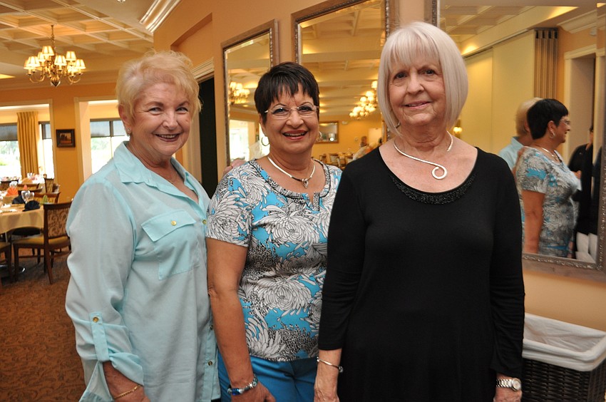 Jan Hollmeyer and Lynn Garbrick pose with Kaye Kuzell, event chairwoman.