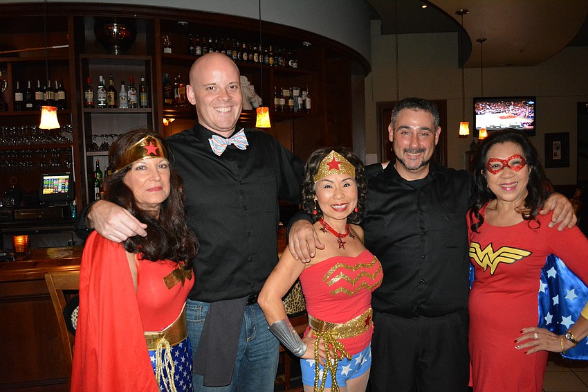 Joyce Donahue of Bradenton, Polo Grill bartender Tim Miller, Hyeyong Temlin of Sun City Center, bartender Jim Pollet and Theresa McCarthy of Bradenton, talk about the most super powerful drinks.