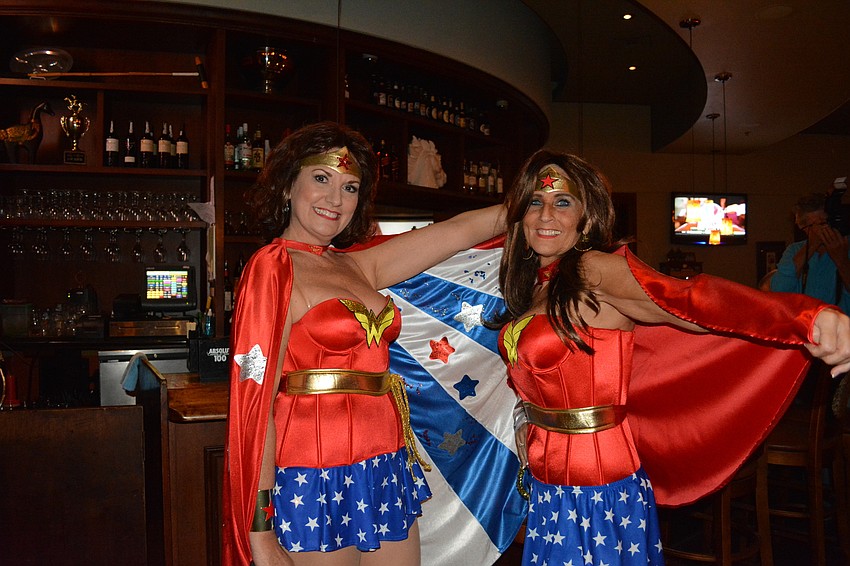 Concetta Rumburg of Sarasota and Ginny Calcutti of Sarasota go on a caped crusade to have fun at Polo Grill on Friday night.