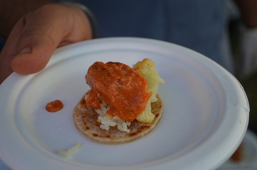 USF culinary students prepared an exotic sample of Makhni Chicken.
