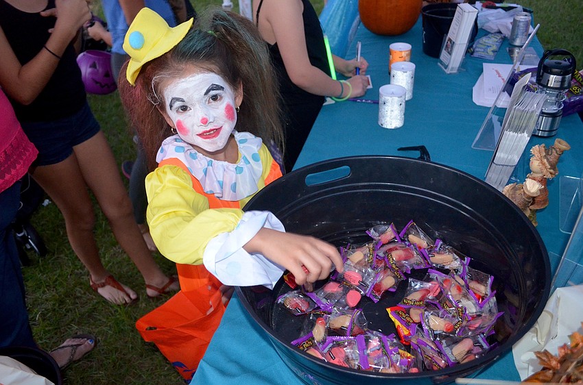 Lily Rivera, of Sarasota, picks out a piece of candy.