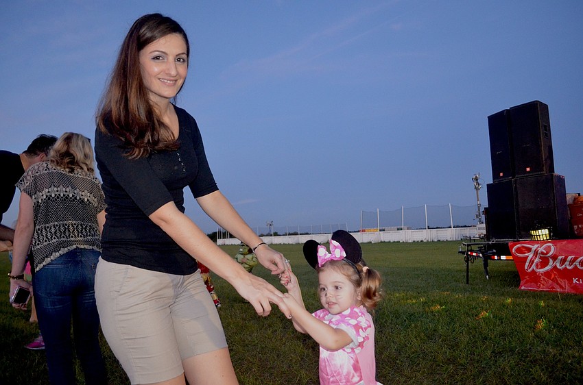 Arnela and Eyla Yildirim, of Lakewood Ranch, dance to pop music.