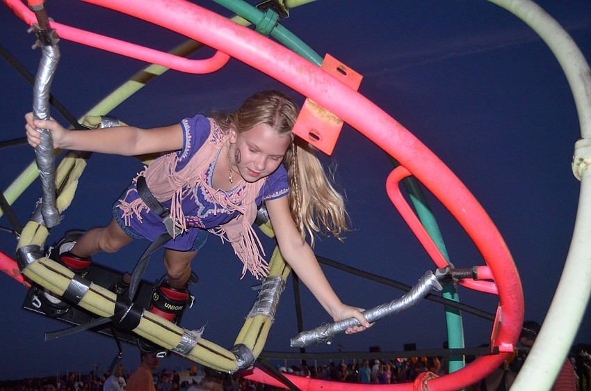 Ranch resident Elaine Zdancewicz whips around in a multi-colored sphere.