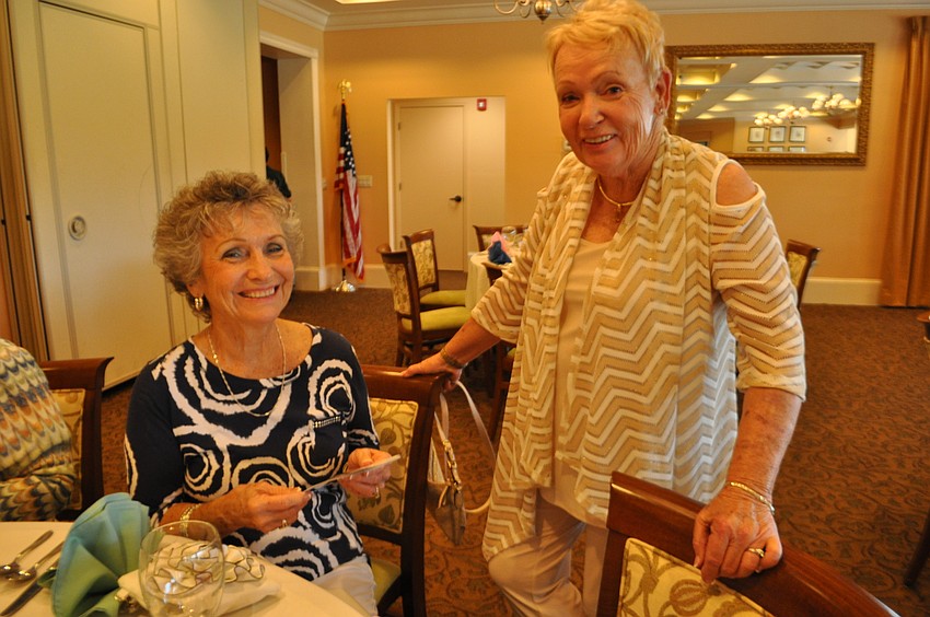 Priscilla Chadwick and Arlene Casey catch up.