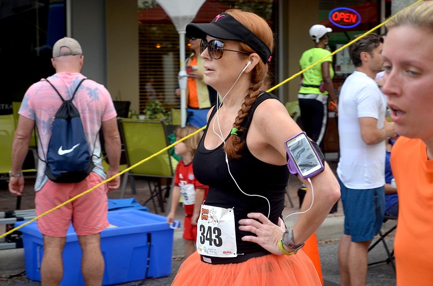 Lesley Hawks, of Venice, catches a breath after running the 5k.
