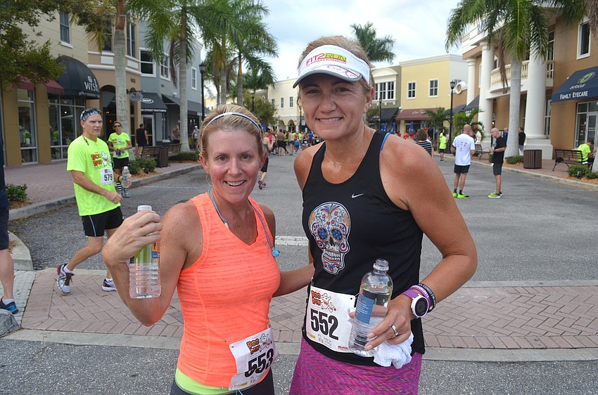 Gina Ferlise and Jenna O'Horan, of Sarasota, sip on cold drinks after the race.