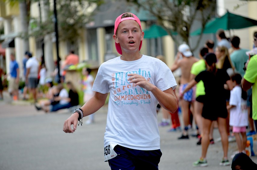 Mason Rademaker, of Lakewood Ranch, sprints through the finish line.