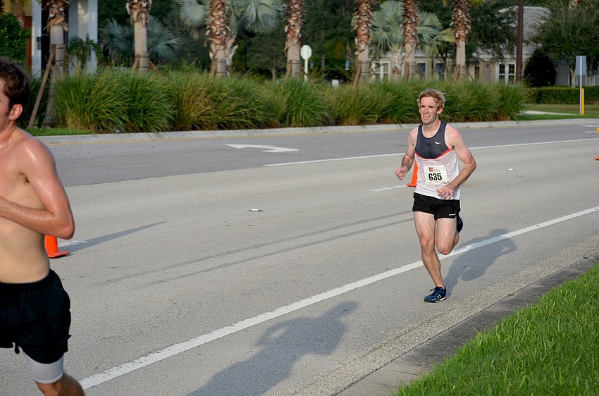 Sean Hopkins, of Bradenton, is one of the first runners to finish.