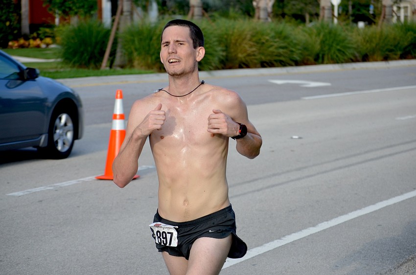 Michael Lamb is the first runner to finish the event.
