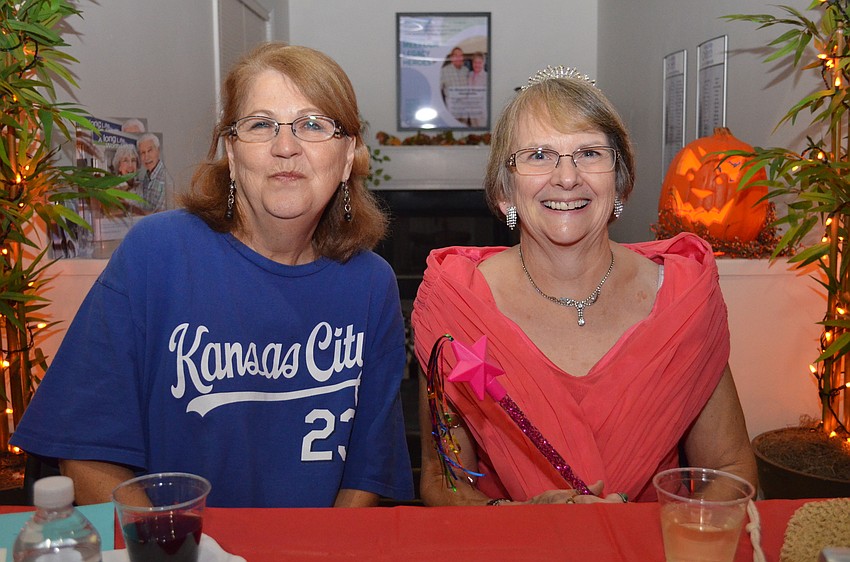 Blue bloods Jo Ann Miller and Cathy Rushwin dressed as a Royals fan and a princess.