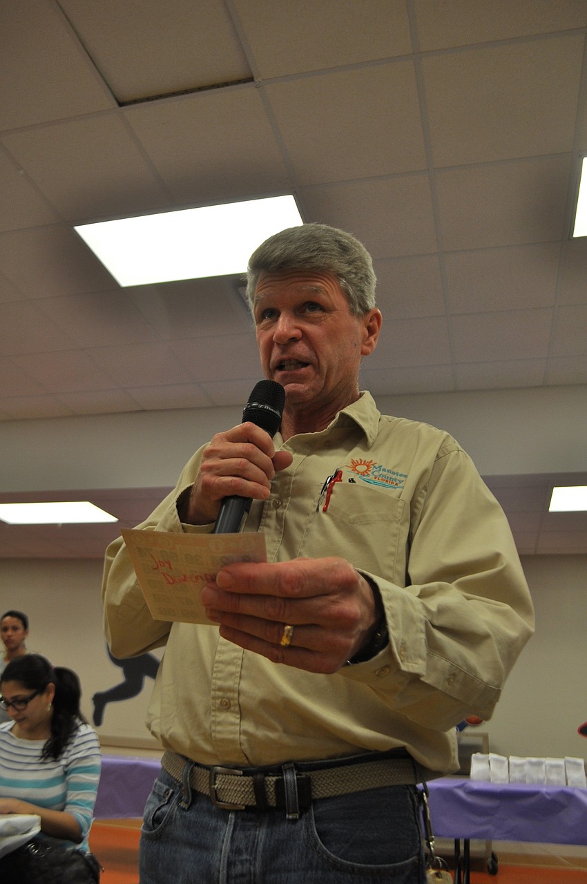 Bob Boulette checks a bingo card to make sure its a winner.