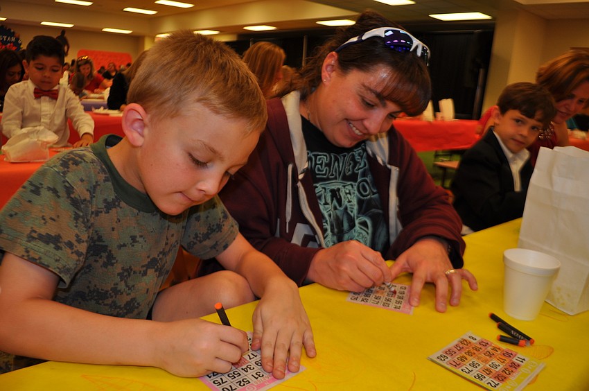 Justin and Julie Stanton mark their cards.