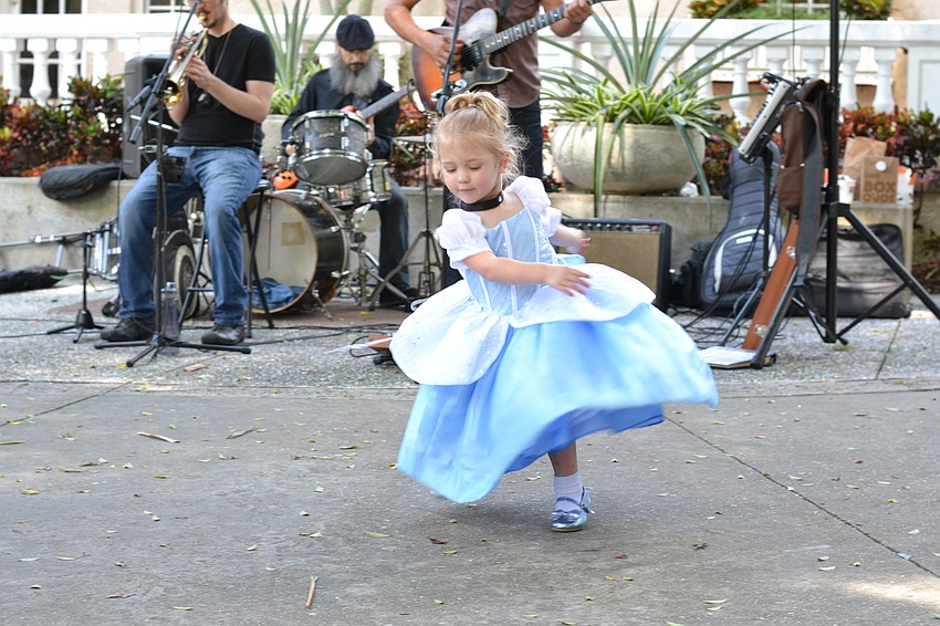Reagan Zielger twirls to the music dressed as Cinderella.