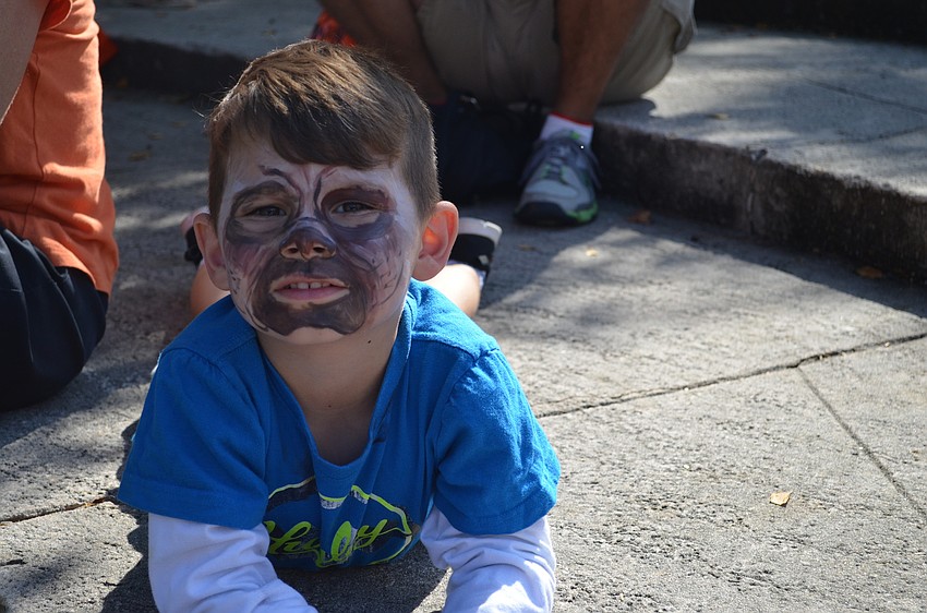 While pups where dressing up like people, Brody Couto painted his face to look like a pug.